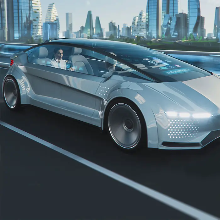 Bei der IAA Mobility dreht sich alles um die Mobilität der Zukunft. In einer futuristischen Szene fährt ein graues Concept Car mit zwei Personen auf einer Strasse. Die Fenster und das Dach sind transparent und gewähren einen großzügigen Einblick in das Fahrzeuginnere.